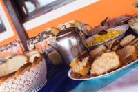 a buffet of bread and other food on a table at Hotel Marina Clube de Pesca in Cananéia