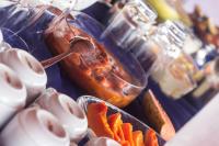 a buffet of food with carrots and other condiments at Hotel Marina Clube de Pesca in Cananéia