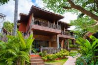 a house in the woods with trees at Palm Leaf Resort Koh Tao in Ko Tao