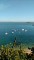 a view of a large body of water with boats at Pousada Portico de Buzios in Armacao dos Buzios