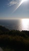 a view of the ocean with the sun shining in the sky at Pousada Portico de Buzios in Armacao dos Buzios