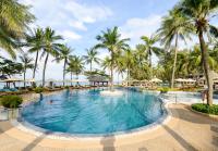 a large swimming pool with palm trees in a resort at Katathani Phuket Beach Resort - SHA Extra Plus in Kata Beach