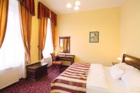 Postel nebo postele na pokoji v ubytování Hotel Ontario
