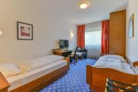 Postel nebo postele na pokoji v ubytování Hotel Zur Mühle