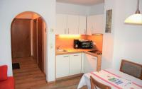 Kuchyňa alebo kuchynka v ubytovaní Tennladen Apartments