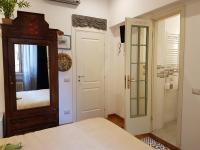 A bed or beds in a room at Vatican Rooms Irene