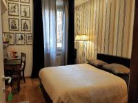 A bed or beds in a room at Vatican Rooms Irene