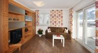 Televízia a/alebo spoločenská miestnosť v ubytovaní Appartements Alpenkristall