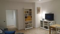 Televízia a/alebo spoločenská miestnosť v ubytovaní Fafà Apartment