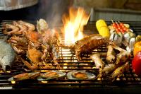 a bunch of seafood and vegetables on a grill at Panviman Resort Koh Phangan - SHA Extra Plus in Thong Nai Pan Noi