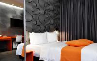 Postel nebo postele na pokoji v ubytování Amazon Hotel