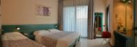Posteľ alebo postele v izbe v ubytovaní Hotel Eden
