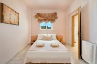 Postel nebo postele na pokoji v ubytování MarySol Luxury Villa