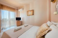 Postel nebo postele na pokoji v ubytování MarySol Luxury Villa