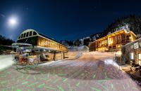 a ski lodge in the snow at night at Sunshine Mountain Lodge in Banff
