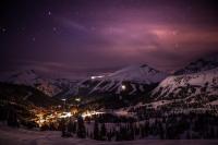 a nightime view of a ski resort in the mountains at Sunshine Mountain Lodge in Banff