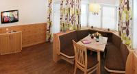 Televízia a/alebo spoločenská miestnosť v ubytovaní Appartements Alpenkristall