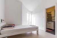 Łóżko lub łóżka w pokoju w obiekcie Apartments Gloria