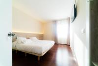 Postel nebo postele na pokoji v ubytování El Pi de Sant Just - Habitacions i Apartaments