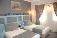 A bed or beds in a room at Hotel Atrium
