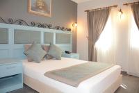 A bed or beds in a room at Hotel Atrium