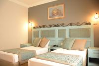 A bed or beds in a room at Hotel Atrium