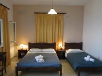A bed or beds in a room at Frosso's Sea Apartments