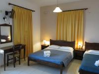 A bed or beds in a room at Frosso's Sea Apartments