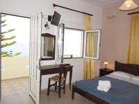 A bed or beds in a room at Frosso's Sea Apartments