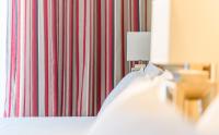 Postel nebo postele na pokoji v ubytování Alkion Hotel