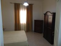 A bed or beds in a room at Appartamenti Budoni