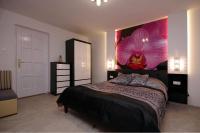 Posteľ alebo postele v izbe v ubytovaní Regina Delux Apartman