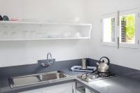 Kuchyňa alebo kuchynka v ubytovaní Bungalows Sa Sargantana