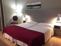 Posteľ alebo postele v izbe v ubytovaní Hotel Valjunco
