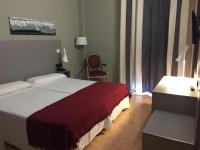 Posteľ alebo postele v izbe v ubytovaní Hotel Valjunco