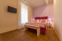La Porta Rossa di Borgo - Vatican Luxury Suiteにあるベッド