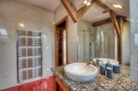 a bathroom with a sink and a large mirror at Residence St Havel Prague Old Town in Prague