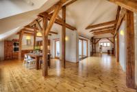 a kitchen and dining room with wooden beams at Residence St Havel Prague Old Town in Prague