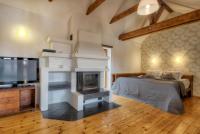 a bedroom with a bed and a fireplace and a tv at Residence St Havel Prague Old Town in Prague