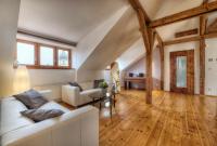 a living room with a white couch and a table at Residence St Havel Prague Old Town in Prague