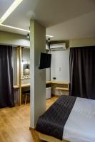 Posteľ alebo postele v izbe v ubytovaní Agamemnon Hotel
