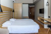 Posteľ alebo postele v izbe v ubytovaní Agamemnon Hotel