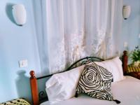 A bed or beds in a room at 9 Musses ROOMS-studios