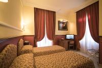 Posteľ alebo postele v izbe v ubytovaní Hotel Donatello