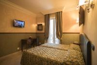 Posteľ alebo postele v izbe v ubytovaní Hotel Donatello