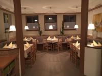 A restaurant or other place to eat at Gästehaus Brugger