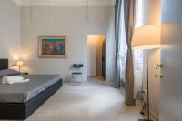 A bed or beds in a room at Beccaria Suite
