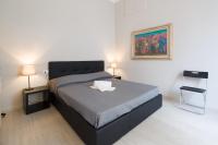 A bed or beds in a room at Beccaria Suite
