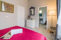 A bed or beds in a room at Beccaria Suite