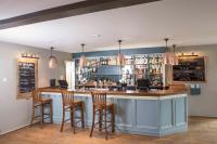 un bar en una habitación con sillas y barra en Kings Court Hotel Alcester, BW Signature Collection, en Stratford-upon-Avon